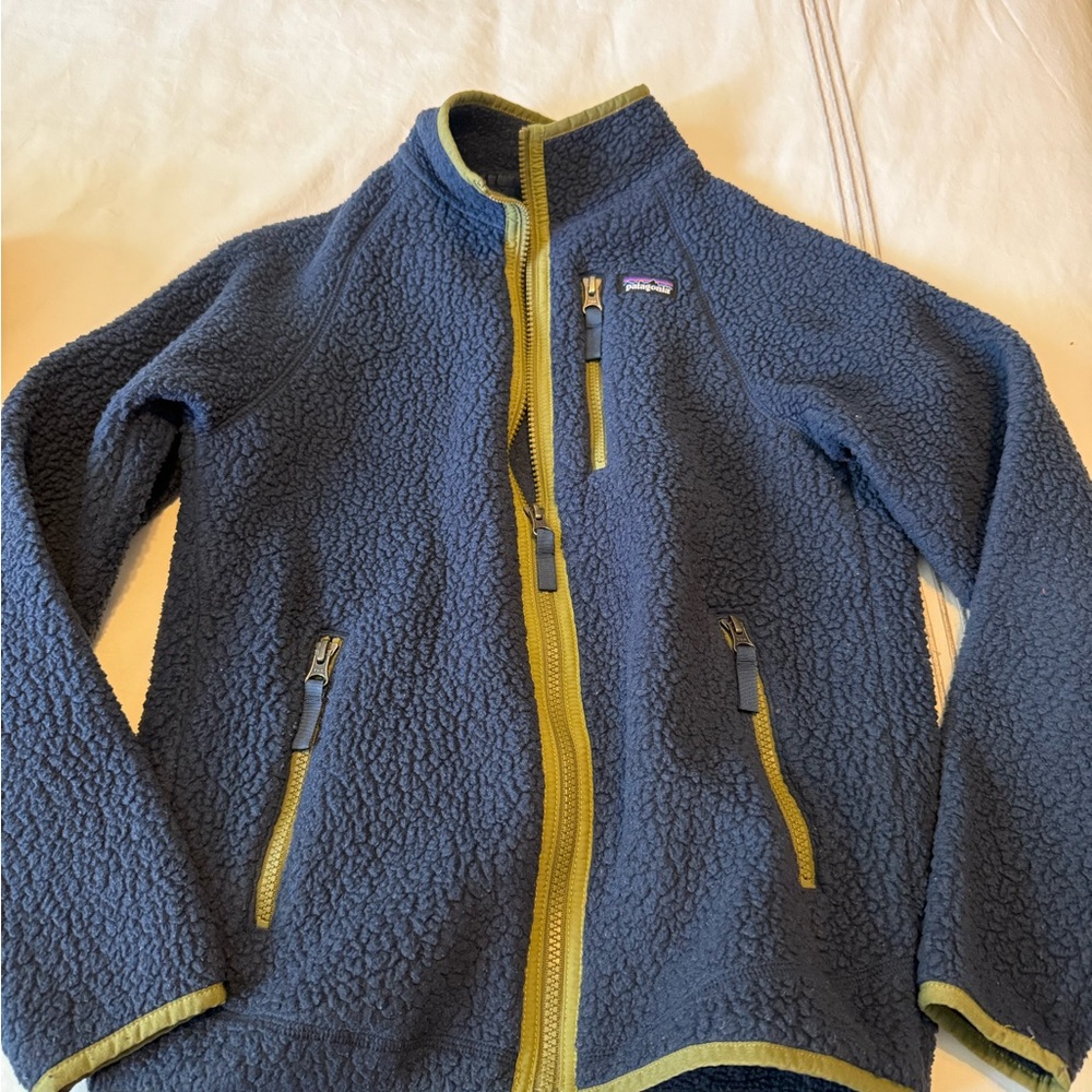 Patagonia Navy Fleece Jacket. Fits boy 8-10 years old